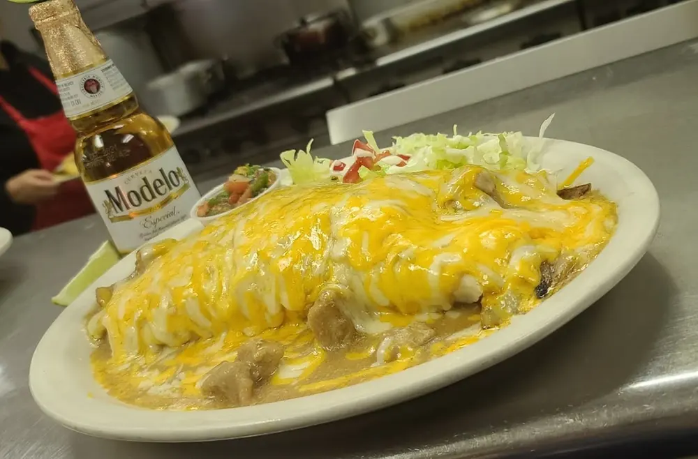 Smothered burrito with cheese and enchilada sauce